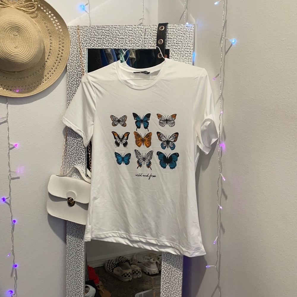 White shirt with butterfly’s (“wild and free”)